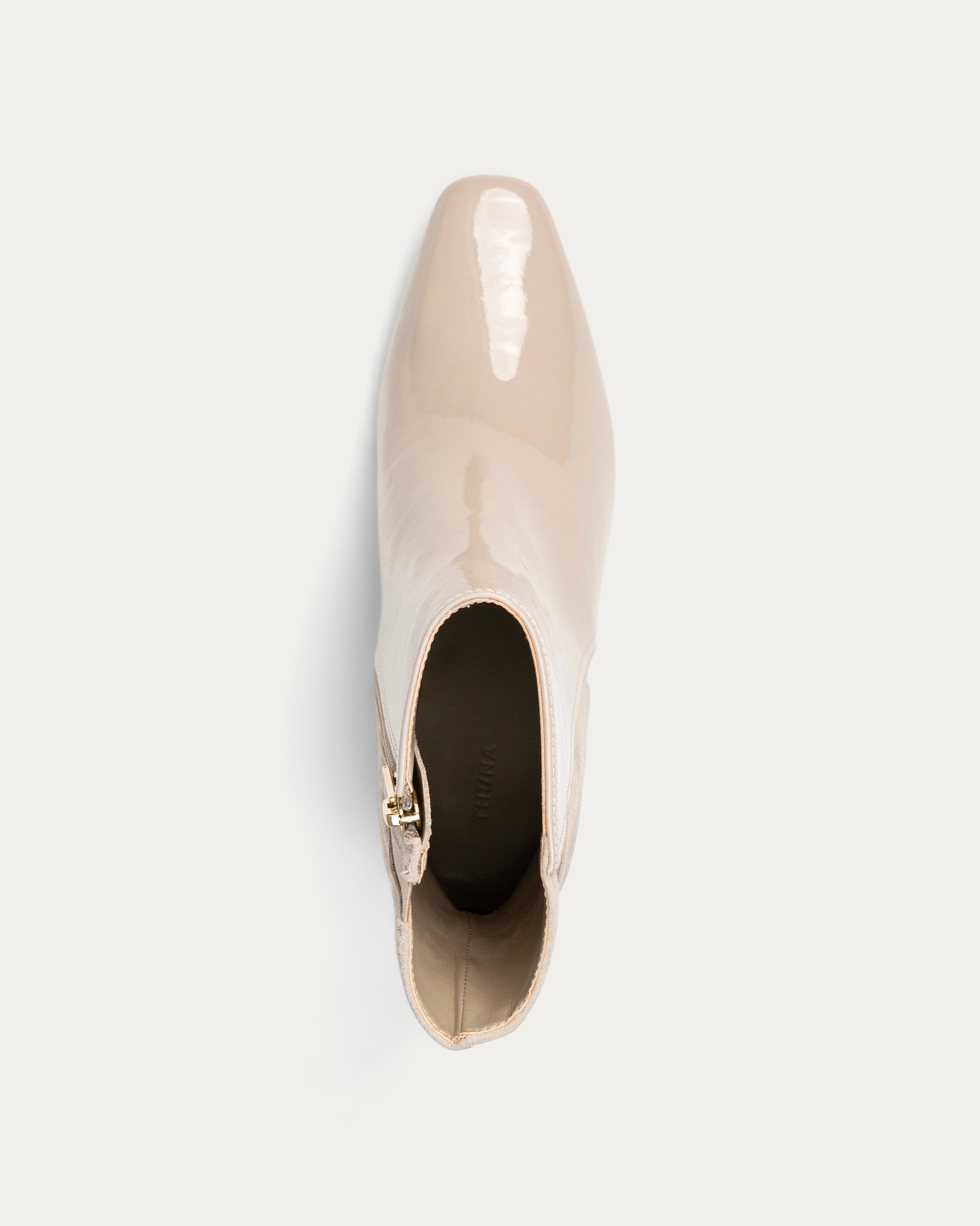 Beige ankle boot with a high heel on a light gray background - Kuwait Shoes - KSA - Qatar- UAE