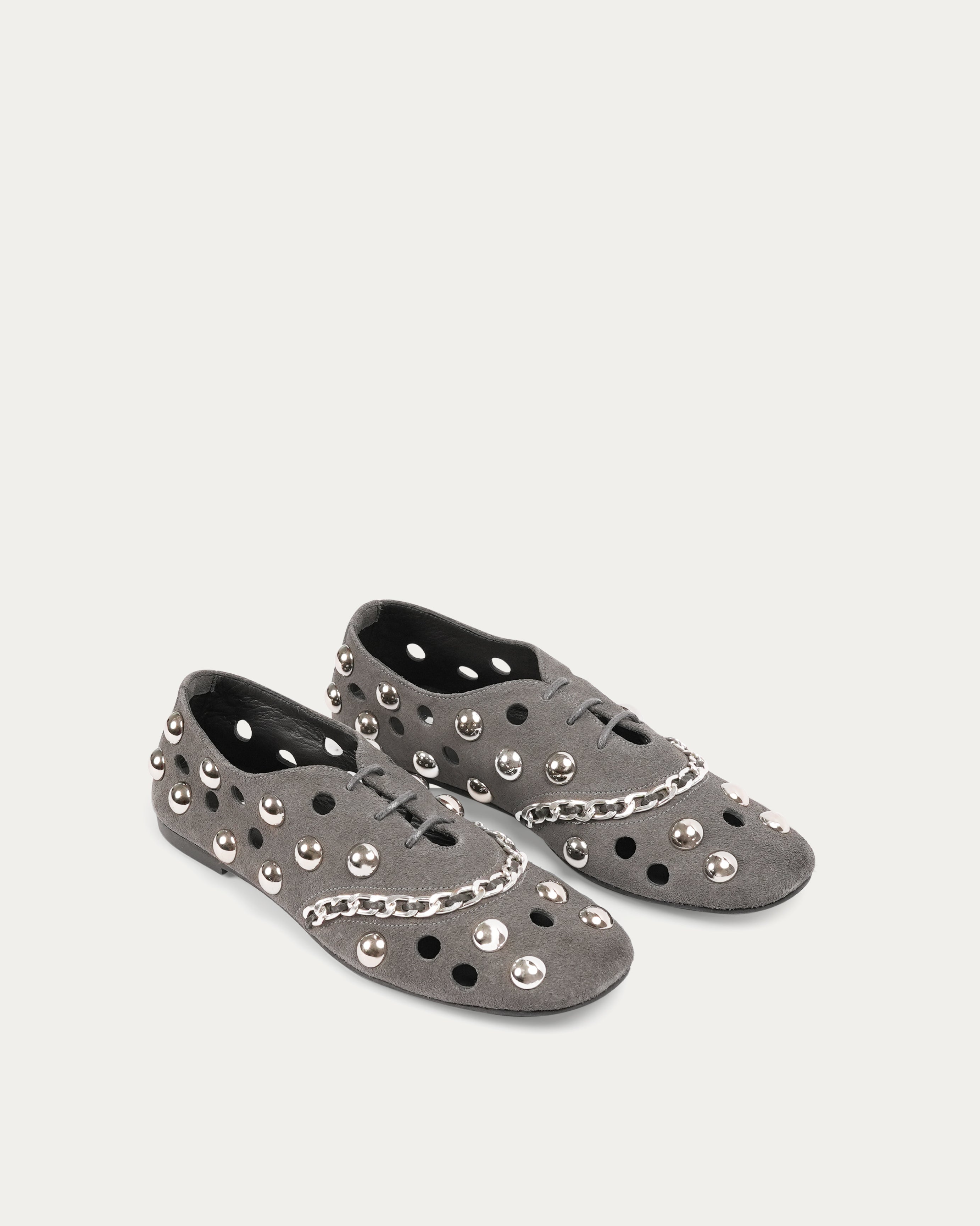 Gray flat shoe with studded details on a white background n- THUNA Kuwait - Saudi 