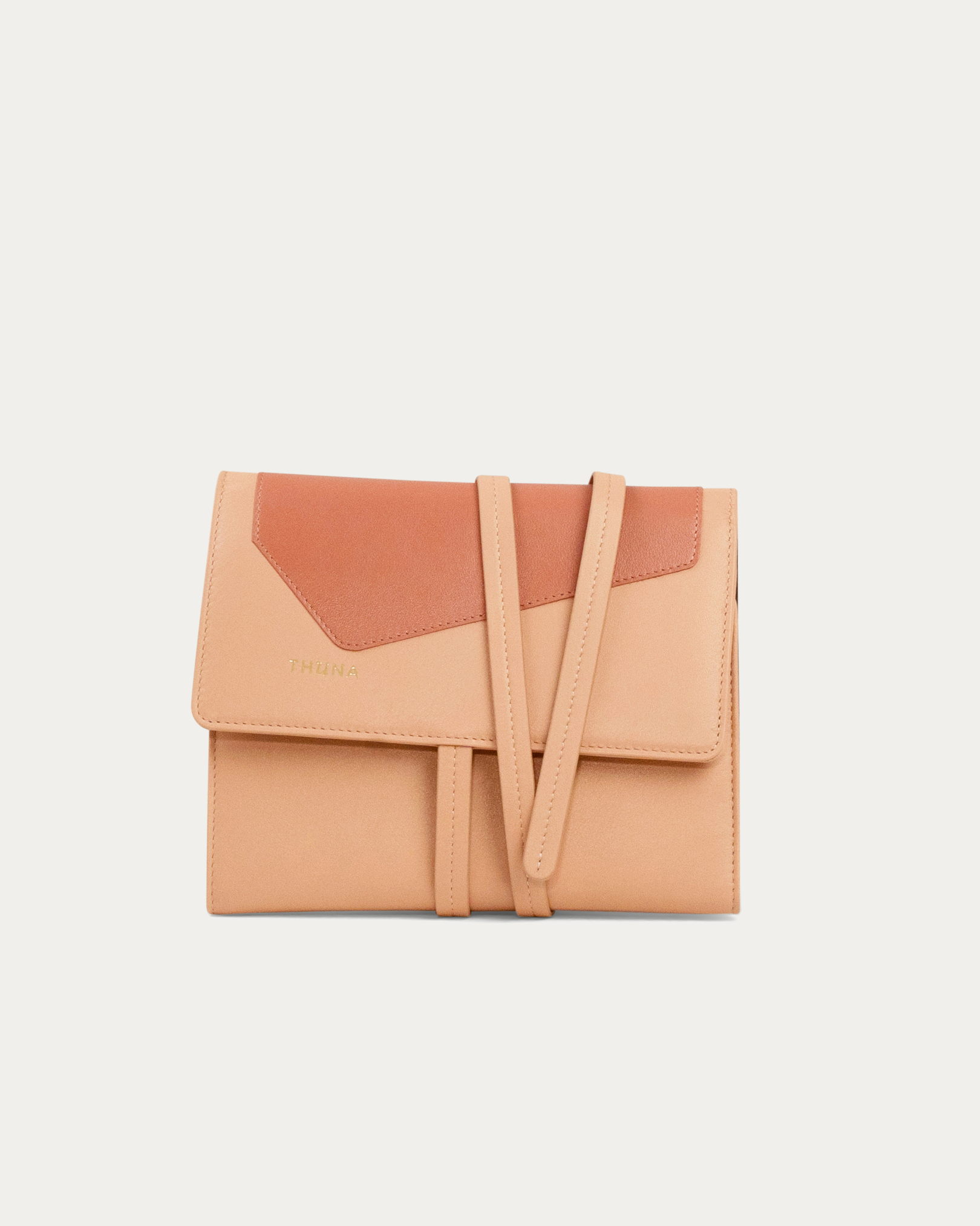 Two-tone beige and brown clutch bag on a light gray background - Kuwait bags 