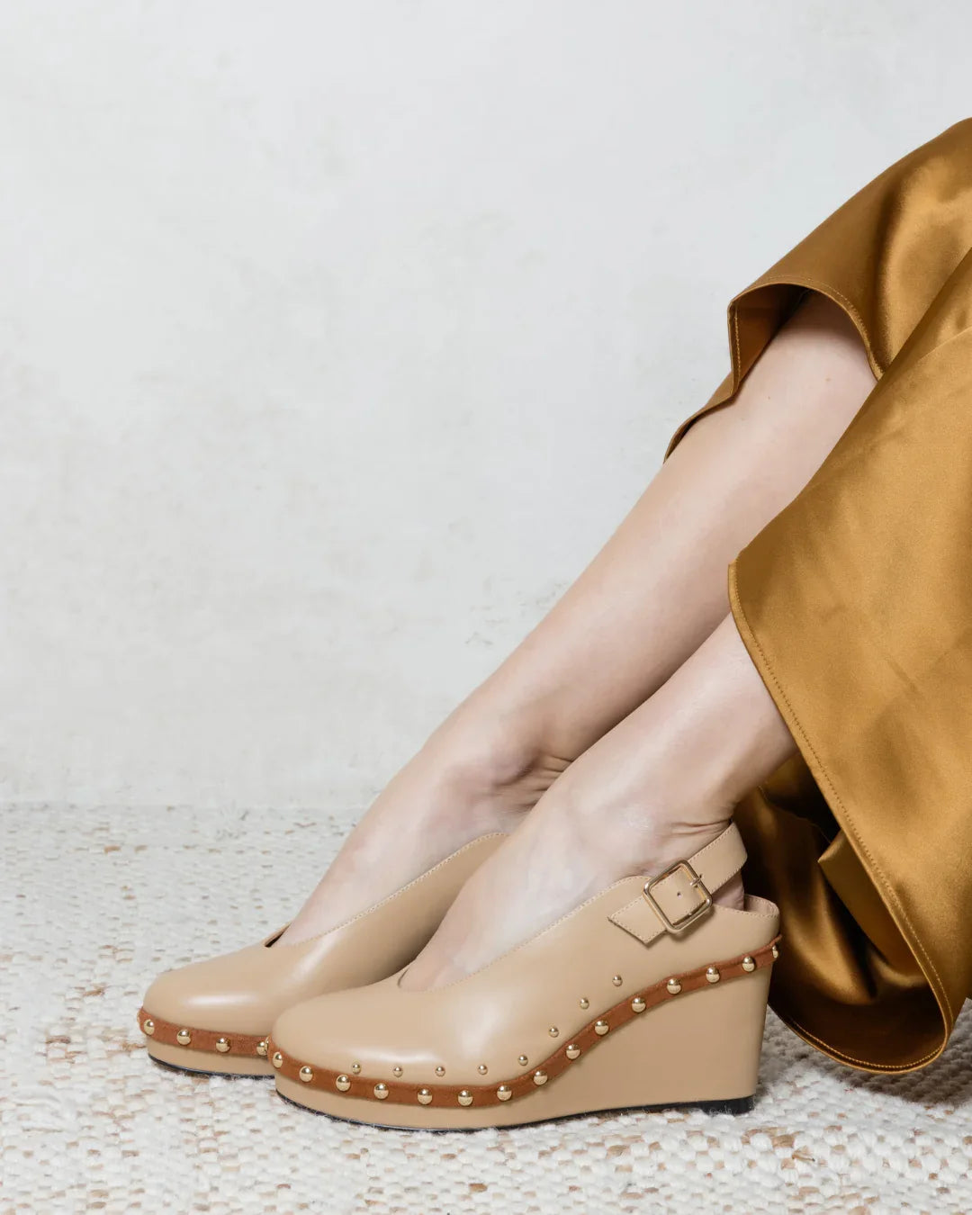 Beige wedge sandals with studded platform and ankle strap, stylish for everyday wear