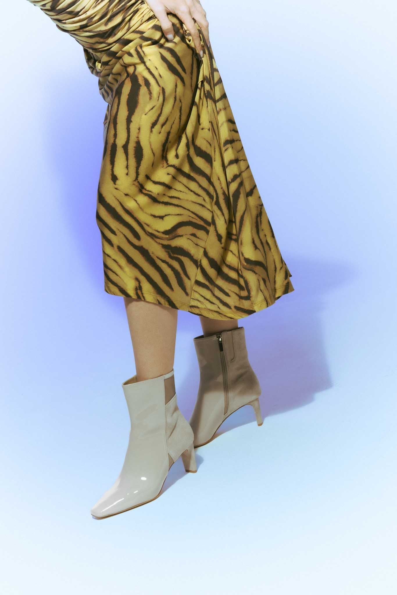 Beige ankle boot with a high heel on a light gray background - Kuwait Shoes - KSA - Qatar- UAE